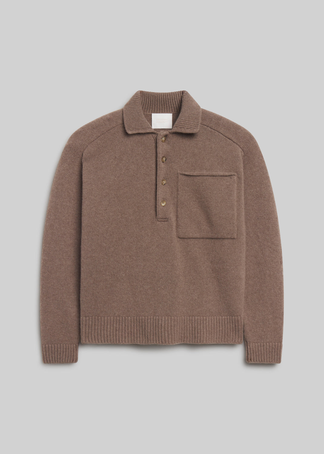Agatha Rugby Sweater in Mushroom Heather, featuring a taupe-brown knit, ribbed collar, four-button placket, front chest pocket, and ribbed cuffs and hem, front view on a grey background.