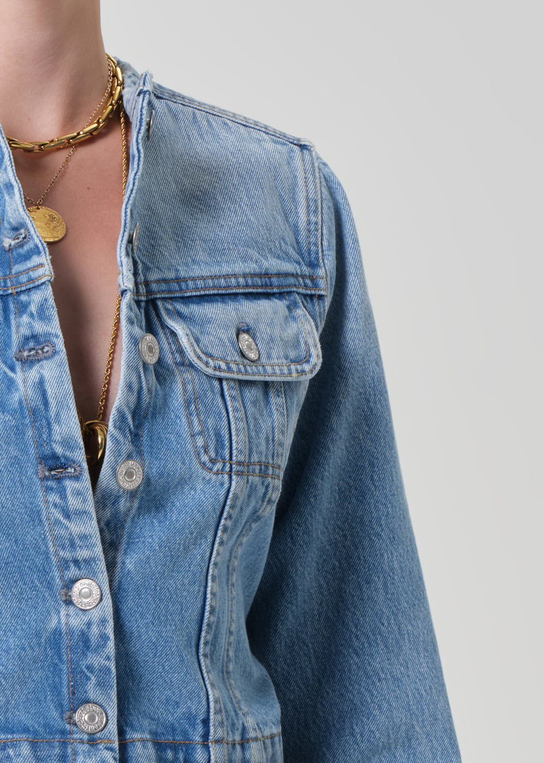 Person wearing a denim jacket