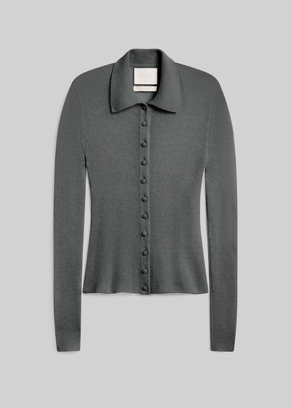 Paloma Cardigan Sweater in Juniper, featuring a fitted silhouette, grey-green ribbed knit, pointed collar, long sleeves, and tonal buttons down the front, front view on a grey background.