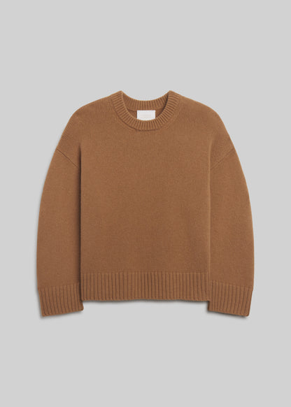 Freshman Crewneck Sweater in Camel, featuring a warm brown knit, relaxed silhouette, dropped shoulders, ribbed crew neckline, cuffs, and hem, front view on a grey background.
