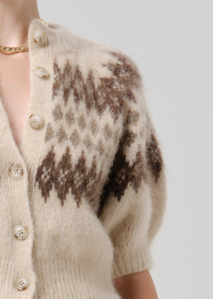 Close up of brown printed cardigan on grey background