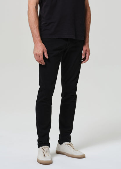 Person wearing a black t-shirt and black jeans