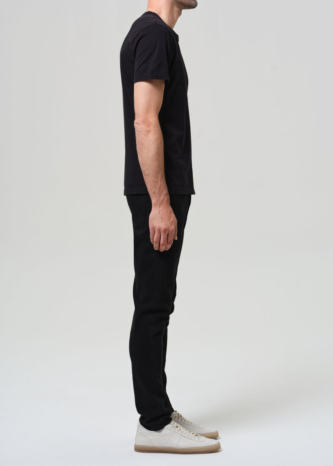 Person wearing a black t-shirt and black jeans