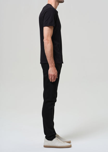 Person wearing a black t-shirt and black jeans