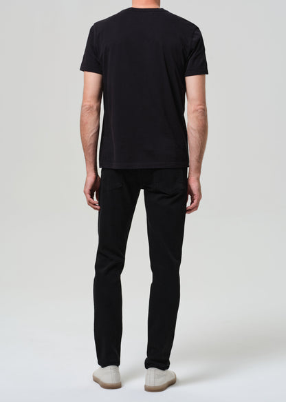 Person wearing a black t-shirt and black jeans