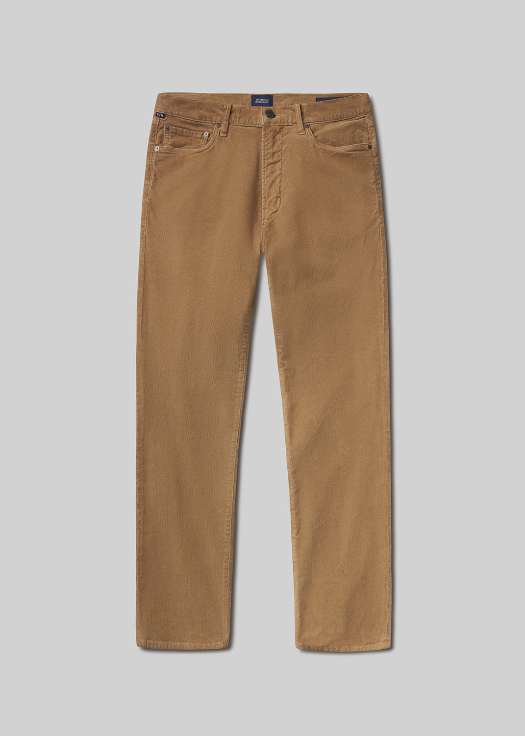 Flat lay shot of brown pants on a grey background