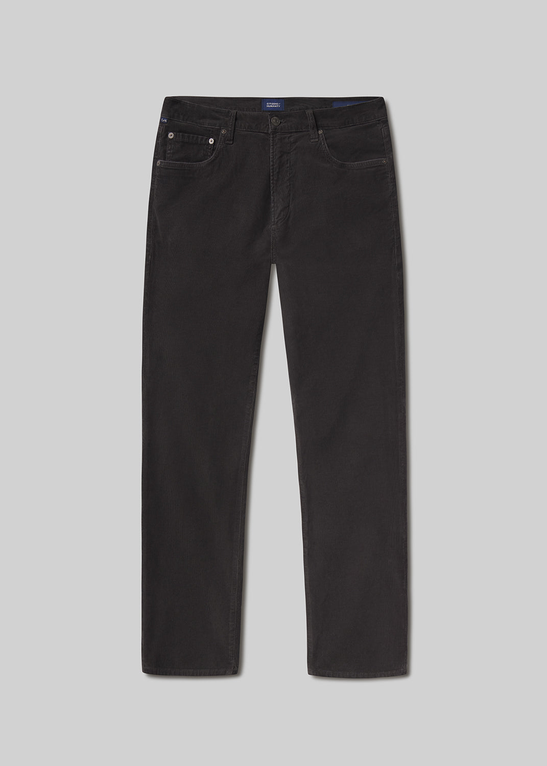 Flat lay shot of black jeans on a grey background