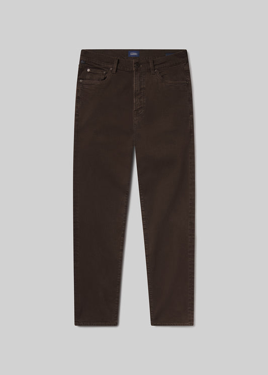 Flat shot of brown jeans on a grey background