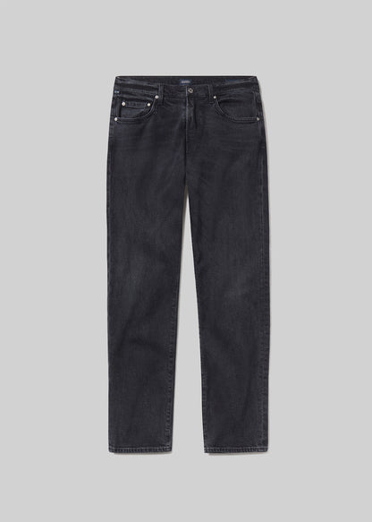A pair of slim-fit dark grey denim jeans shown flat against a grey background.