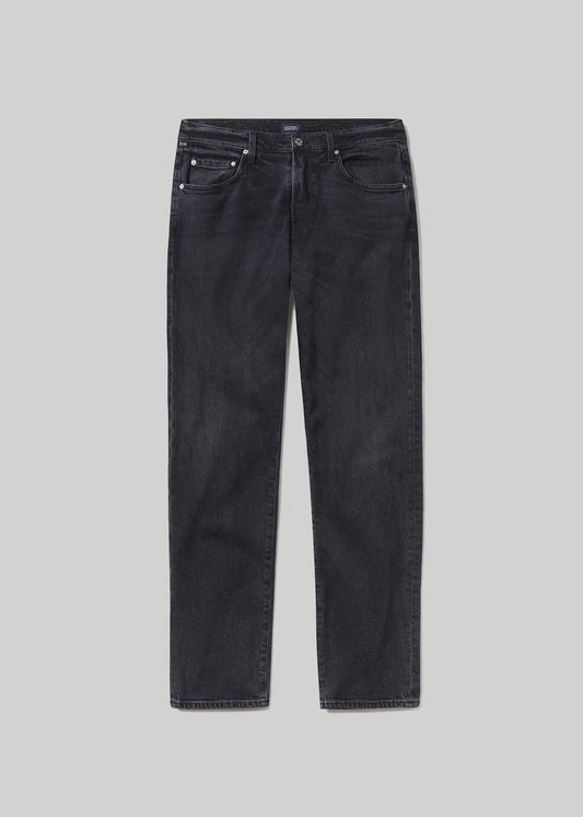 A pair of slim-fit dark grey denim jeans shown flat against a grey background.