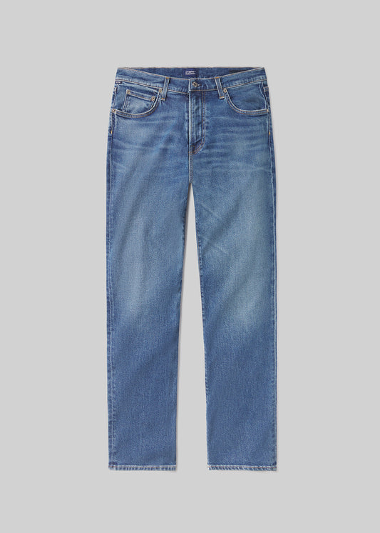 A pair of blue jeans on a grey background