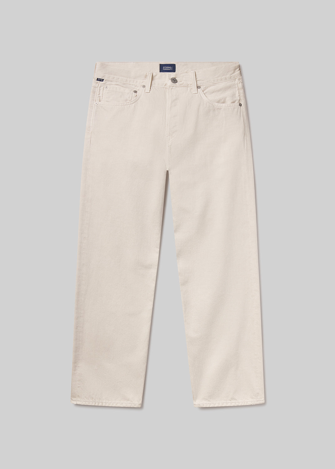 Beige pants on a grey background