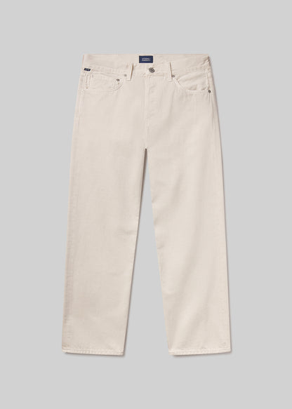 Beige pants on a grey background