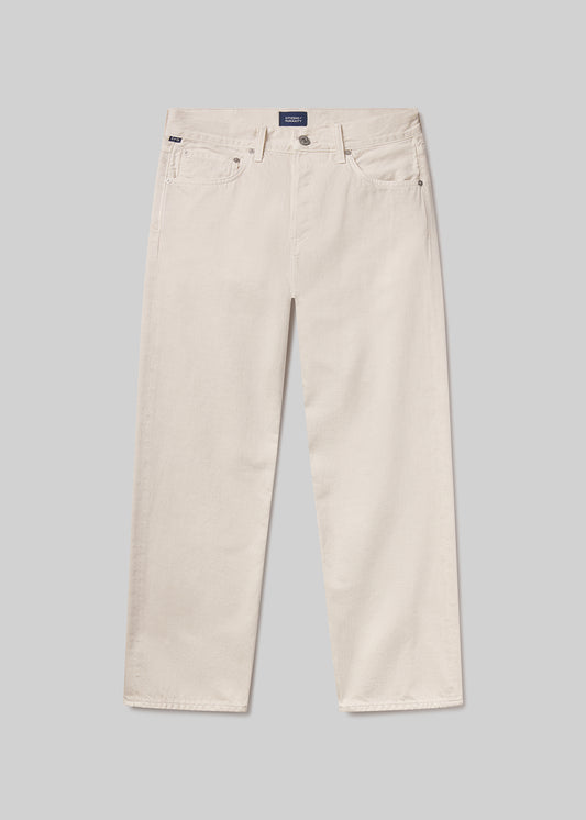 Beige pants on a grey background