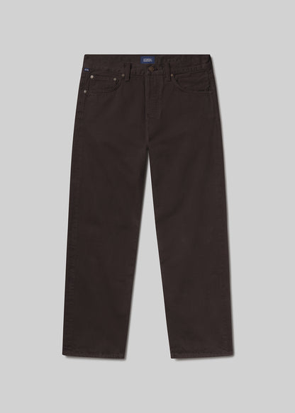 Flat shot of dark brown pants on a light grey background