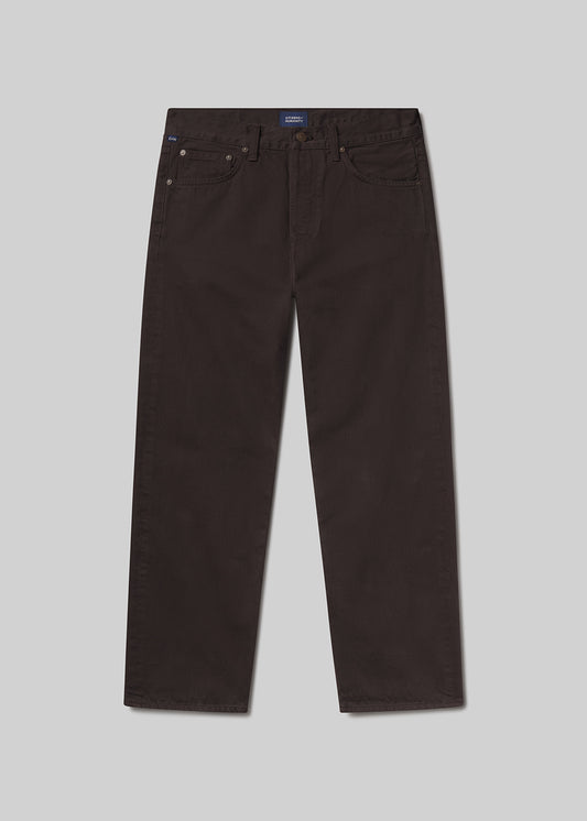 Flat shot of dark brown pants on a light grey background