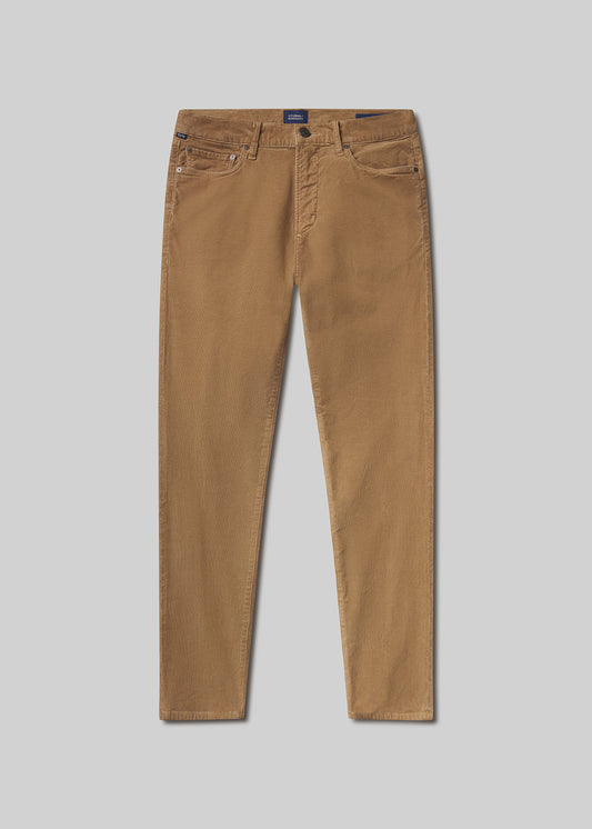 Flat lay shot of tan pants on a gray background