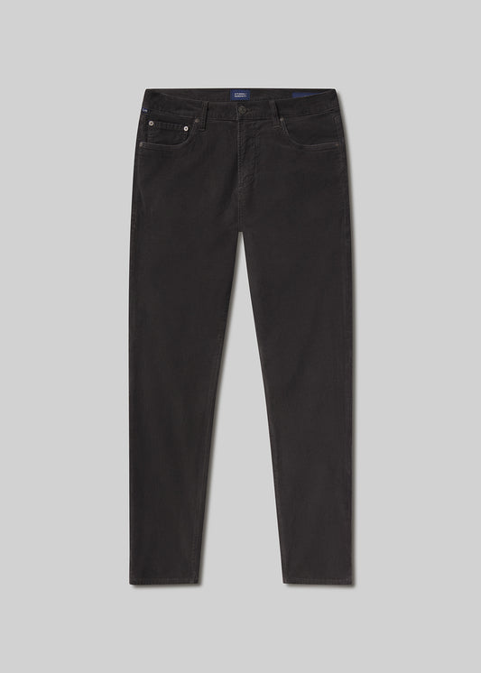 Flat lay shot of dark grey jeans on a grey background