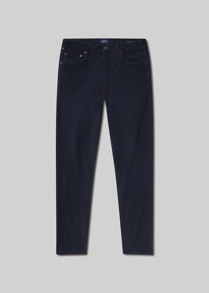 Flat lay shot of navy blue jeans on a light grey background