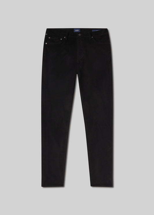 Flat lay shot of black jeans on a grey background
