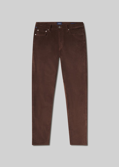 Flat lay of brown pants on a grey background