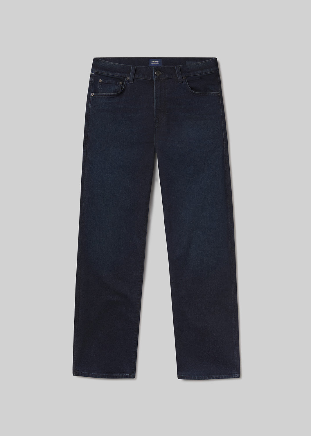 Flat ay of dark blue jeans on a light grey background