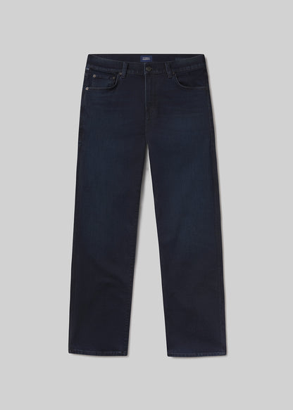 Flat ay of dark blue jeans on a light grey background