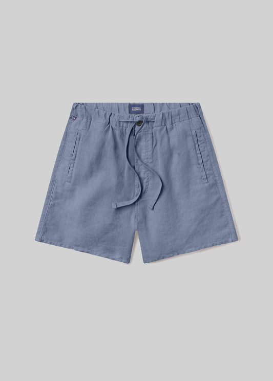 Stone blue drawstring shorts with an elastic waistband, adjustable drawstring, and side pockets, front flat lay view on a grey background.