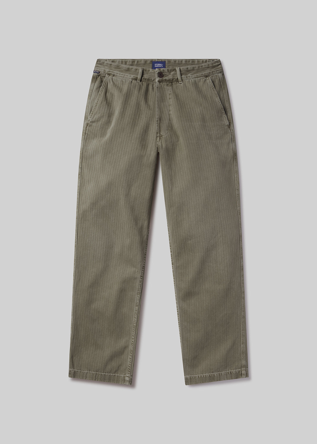 Flat lay shot of a pair of olive green pants on a light grey background