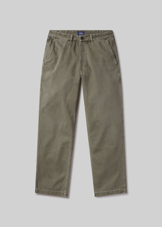 Flat lay shot of a pair of olive green pants on a light grey background
