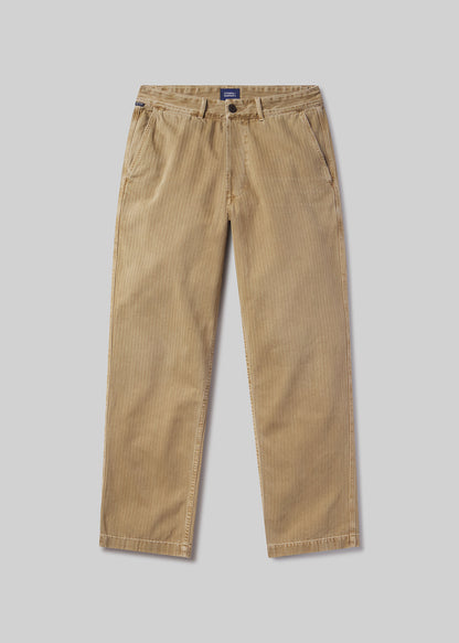 Beige corduroy pants on a grey background