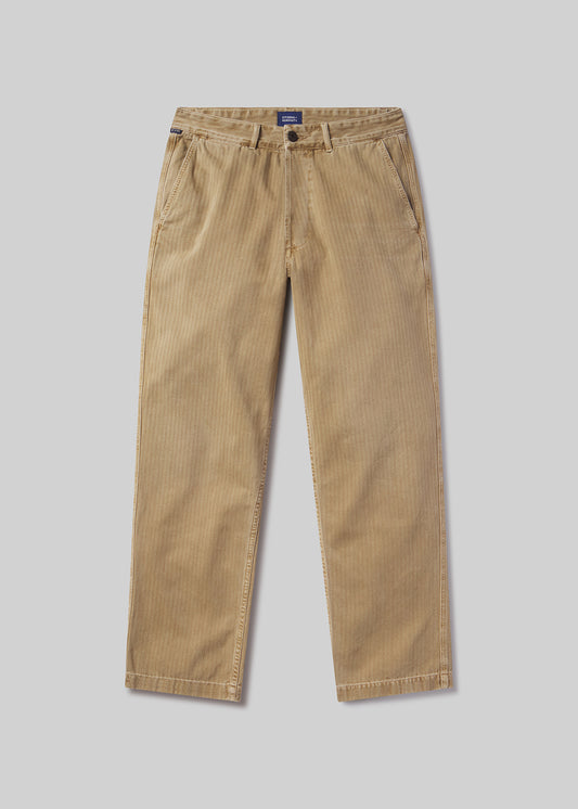 Beige corduroy pants on a grey background