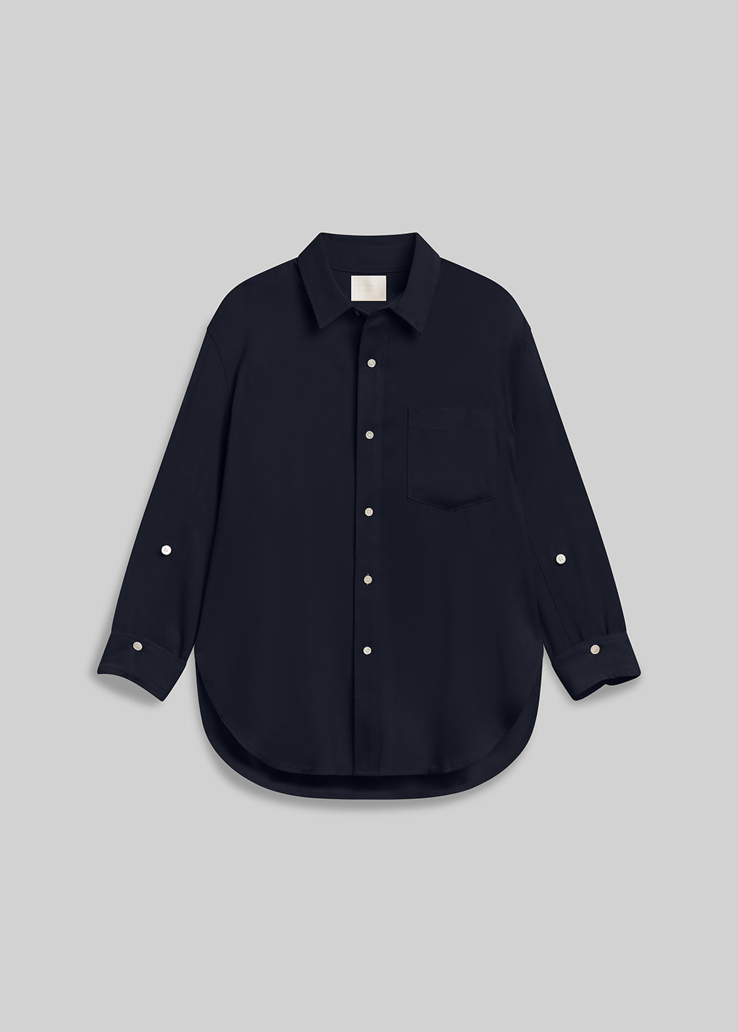 Navy long sleeve button-down shirt with chest pocket on grey background