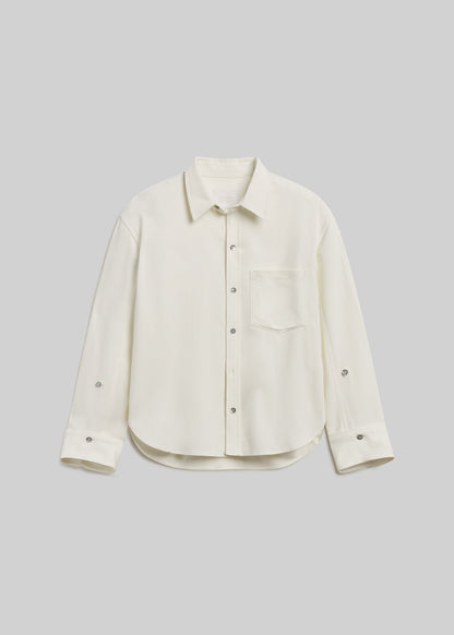 Winter white long-sleeve button-front shirt with chest pocket on grey background