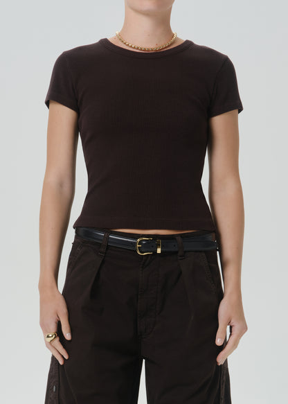 A model wearing a dark brown short-sleeve crewneck t-shirt, paired with black pants and a black belt, against a grey background.