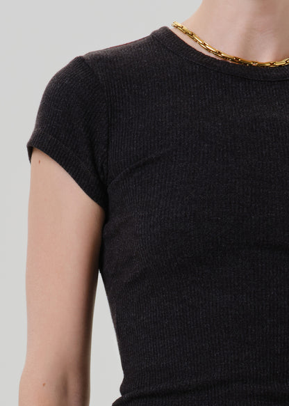 Close-up of a black ribbed cap sleeve tee on a grey background