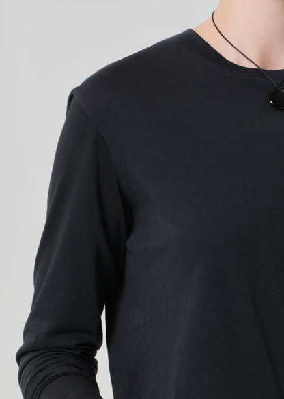 Black long-sleeve shirt on a gray background