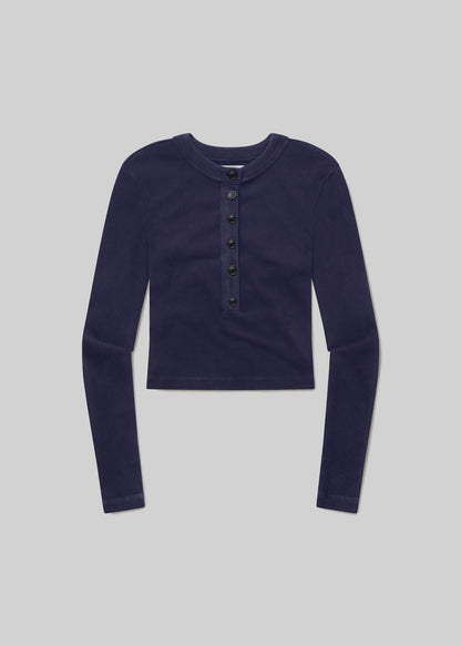 Mineral navy long-sleeve ribbed Henley top with a round neckline, six-button front placket, fitted silhouette, and straight hem, front flat lay view on a grey background.