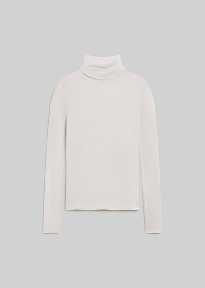 White long-sleeve turtleneck top with a relaxed silhouette, folded high neckline, and straight hem, front flat lay view on a grey background