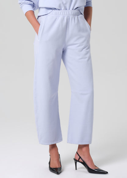 Light blue pants worn by a person on a grey background