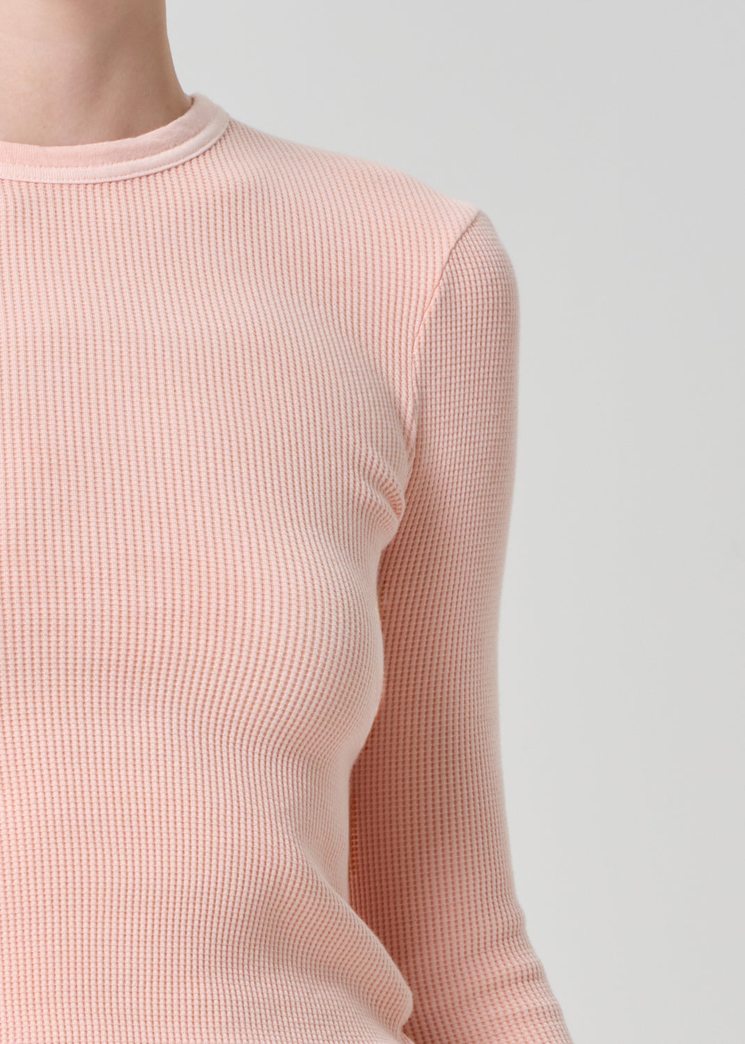 Person wearing a pink top