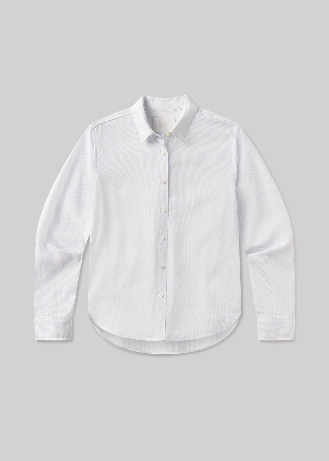 White dress shirt with blue stripes on a light gray background