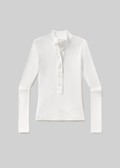 White long-sleeve ribbed henley top with a mock neckline, partial button placket, and fitted silhouette, front flat lay view on a grey background.