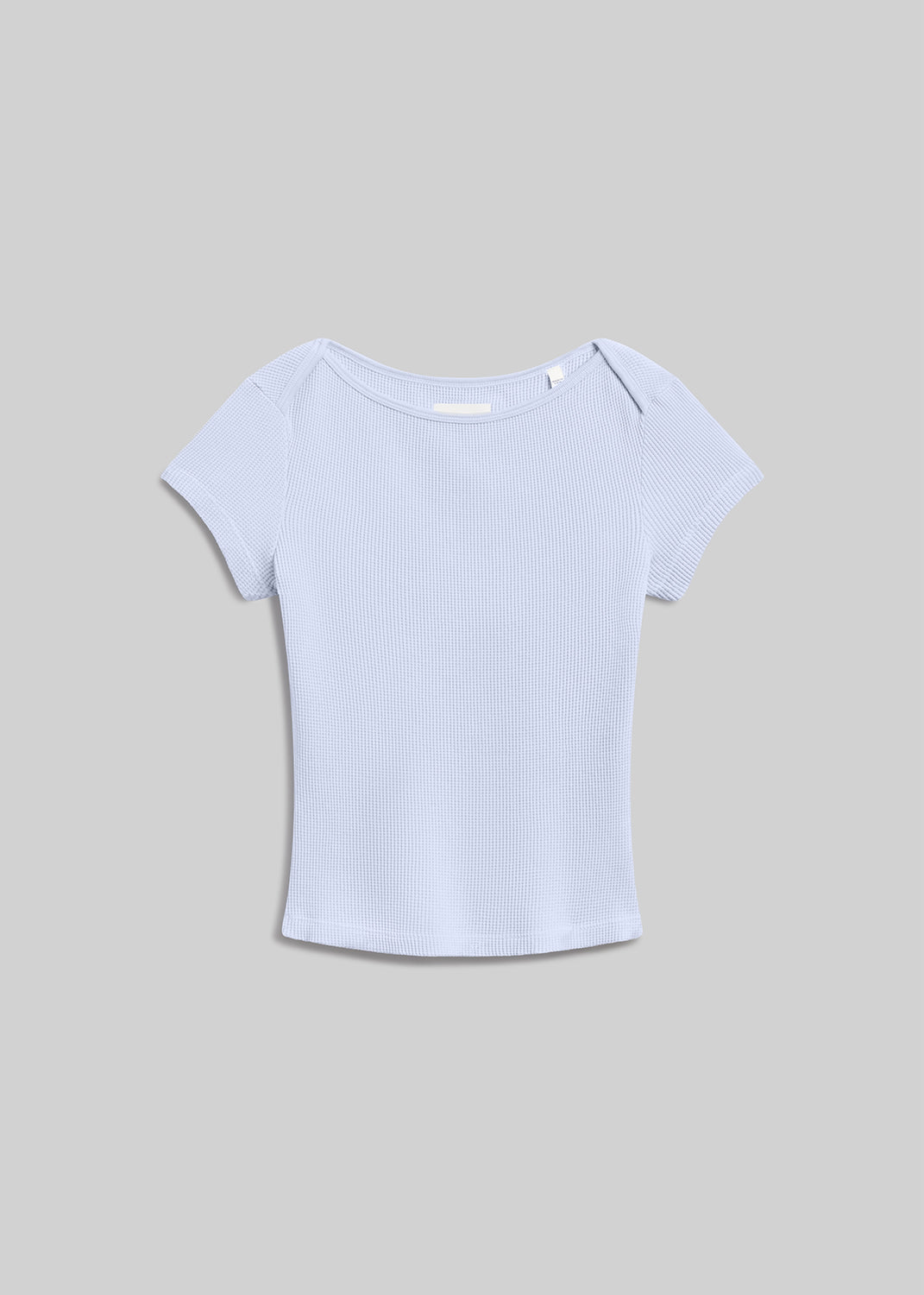 Light blue waffle-knit short-sleeve tee with a wide round neckline, fitted silhouette, and textured finish, front flat lay view on a grey background.
