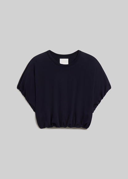 Navy short-sleeve bubble tee on grey background