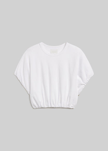 Soft white short-sleeve bubble tee on grey background
