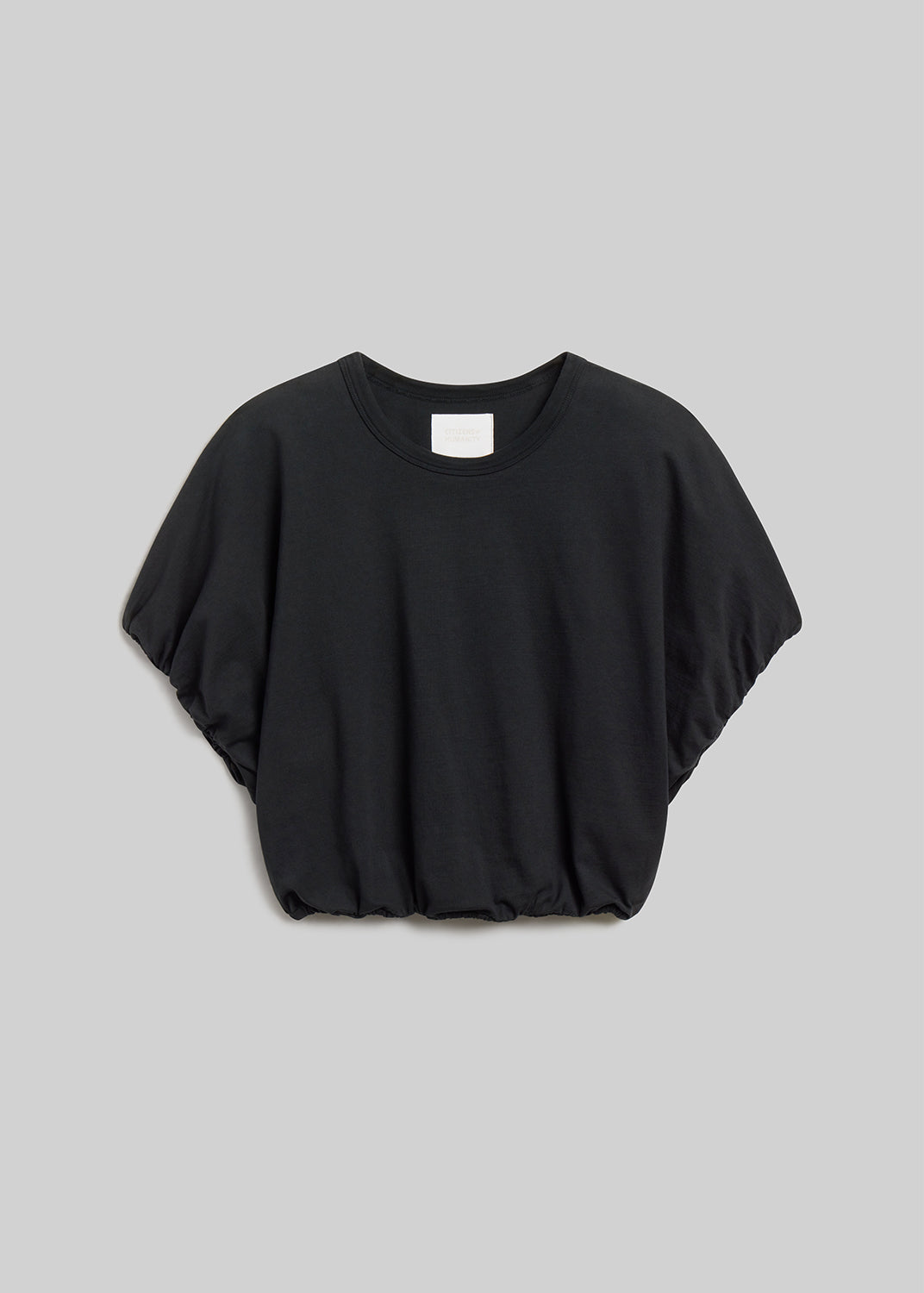 Washed black short-sleeve bubble tee on grey background