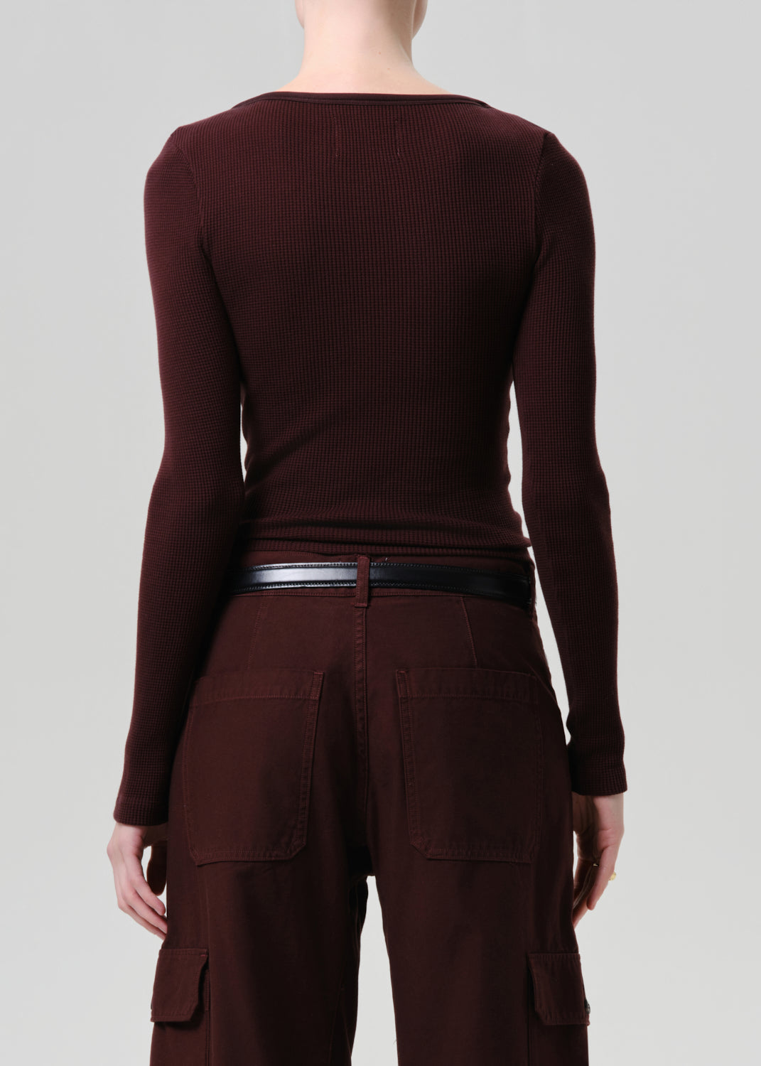 Purple brown long-sleeve top and cargo pants on a grey background
