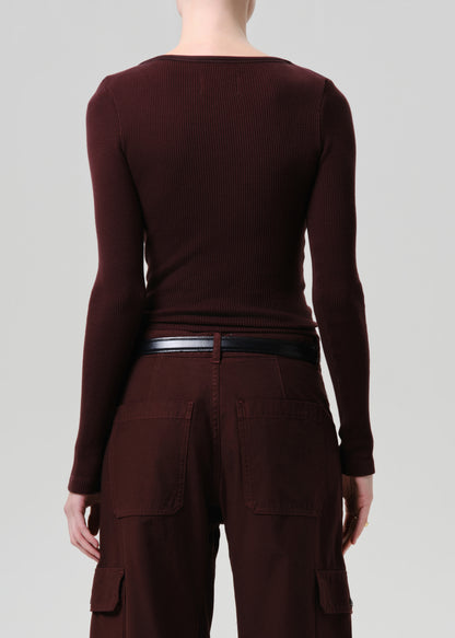 Purple brown long-sleeve top and cargo pants on a grey background