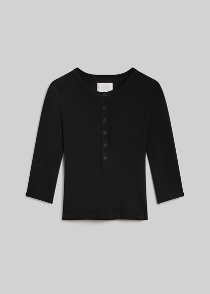 Juniper three-quarter sleeve ribbed henley top with a round neckline and six-button front placket, front flat view on a grey background.